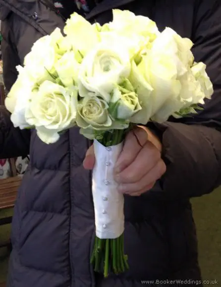 All White Wedding Flowers with no Greenery Hand-tied Bridal Bouquet with White Roses, Spray Roses and Ranunculus Side View