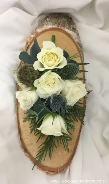 Wedding corsage for winter wedding of Ivory spray roses and Eryngium for Mother of the Bride