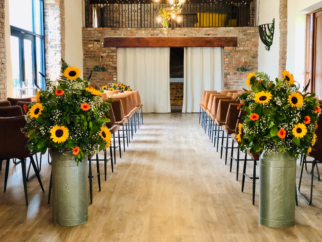 Bright Sunflower Floral Arrangements in Milk Churns