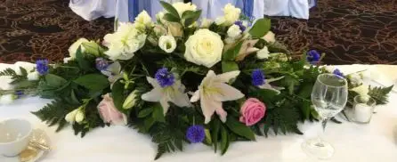 White and Pink Rose and Blue Top Table Arrangement Back