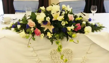 White and Pink Rose and Blue Top Table Arrangement Front