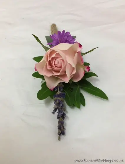 Just picked country wild style buttonhole with spray roses, aster and lavendar tied with twine top view
