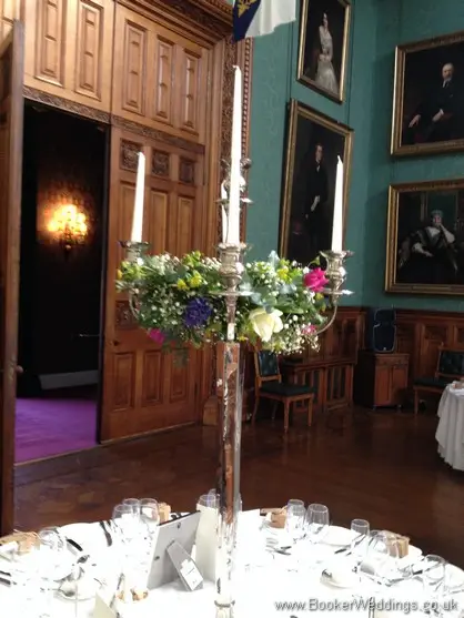 Spring Mix Candelabra Centrepiece at Knowsley Hall with flowers in the arms Ivory rose, purple tulips, blue hyacinth, gypsophila