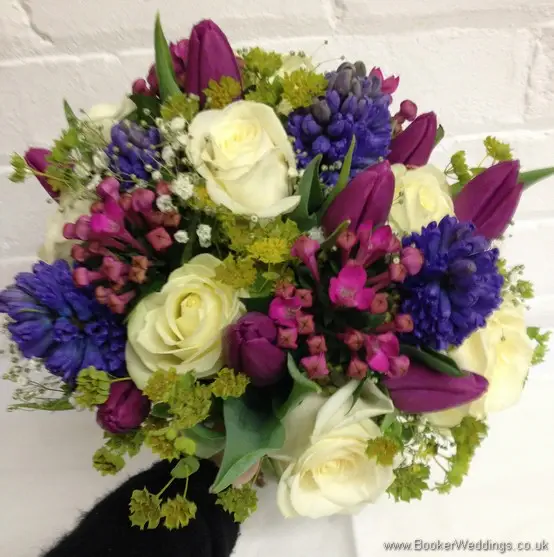 Spring Mix Pinks Purples and Blues Bridal Bouquet with Ivory rose, purple tulips, blue hyacinth, gypsy grass, pink bouvardia