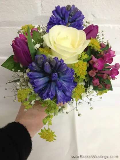Spring Mix Pinks Purples and Blues Bridesmaid Bouquet with Ivory rose, purple tulips, blue hyacinth, gypsy grass, pink bouvardia Tilted View