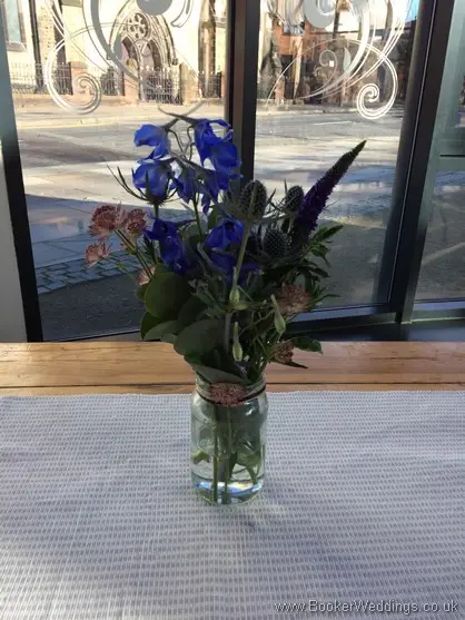 Blue Pink and Purple Wild Flowers in Jars Table Centrepieces at Siren 54 St James Street Liverpool