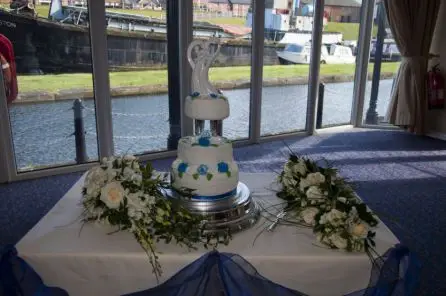 White Rose and Dendrobium Orchid Bouquets used as Cake Table Decorations