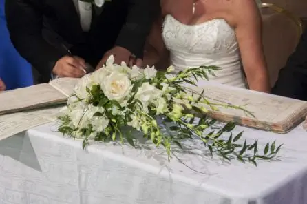 White Rose and Dendrobium Orchid Brides Bouquet used as Registrars Table Arrangement