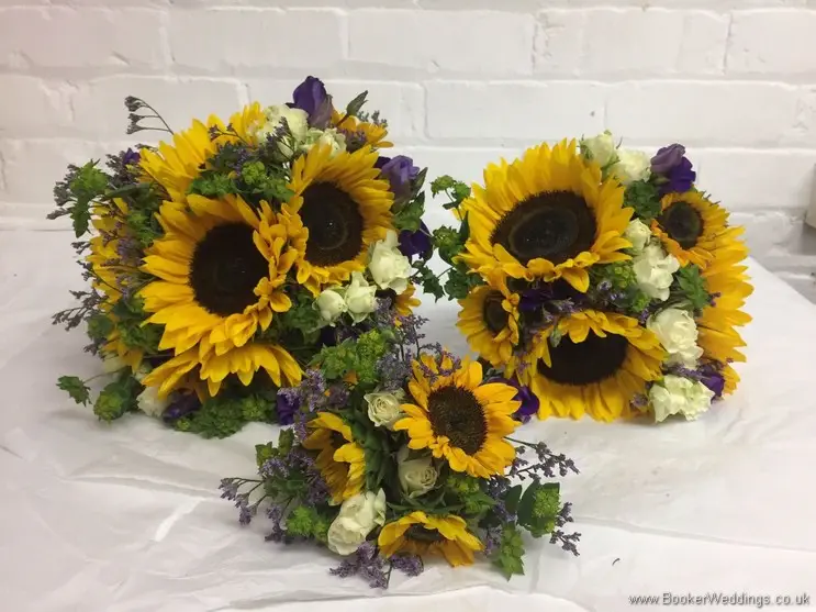 Brides, Bridesmaid & Flowergirl yellow, white and purple bouquets