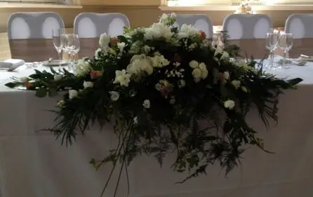 Top Table Arrangement of Peony, Roses, Lissianthus and Freesia