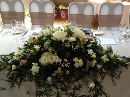 Top Table Arrangement of Peony, Roses, Lissianthus and Freesia