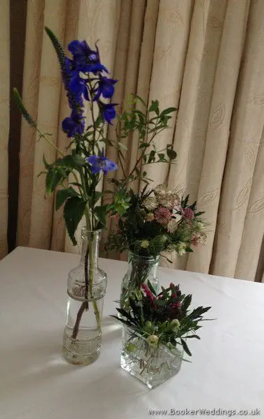 Blue Delphinium, Purple Veronica, Heather, Astrantia, Eryngium, Nigella Jam Jar Table Decorations at The Hope Street Hotel, Liverpool