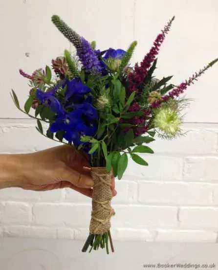 English Garden Just Picked Flowers Bridesmaid  Bouquet with Blue Delphinium, Eryngium, Heather, Astrantia, Purple Veronica & Nigella Side View