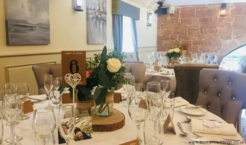 Table Arrangements of Glass Jars with Flowers
