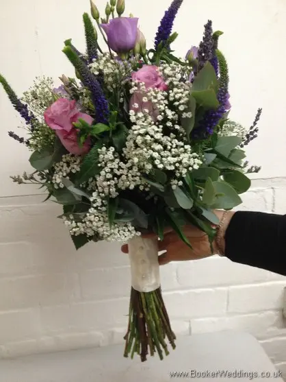 Just Picked Country Flowers in purples and lilacs with grey foliage with roses, lissianthus, veronica, gypsy grass and eucalyptus - Hand tied Bridal Bouquet