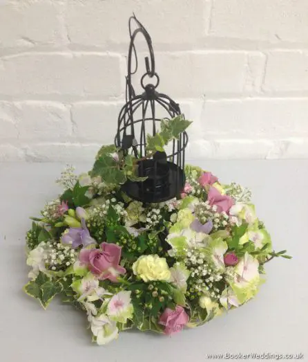 Black Bird cage table centerpieces with Pastel flowers of Peony, Rose, Hydrangea and Freesia