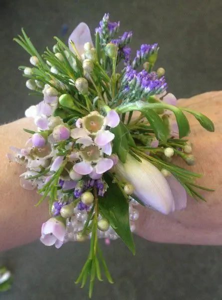 Freesia and wax flower wrist corsage