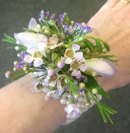 Freesia and wax wrist corsage side view