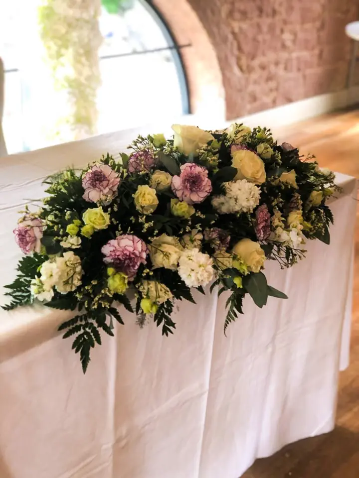White and Cream Top Table Arrangement at Allerton Manor