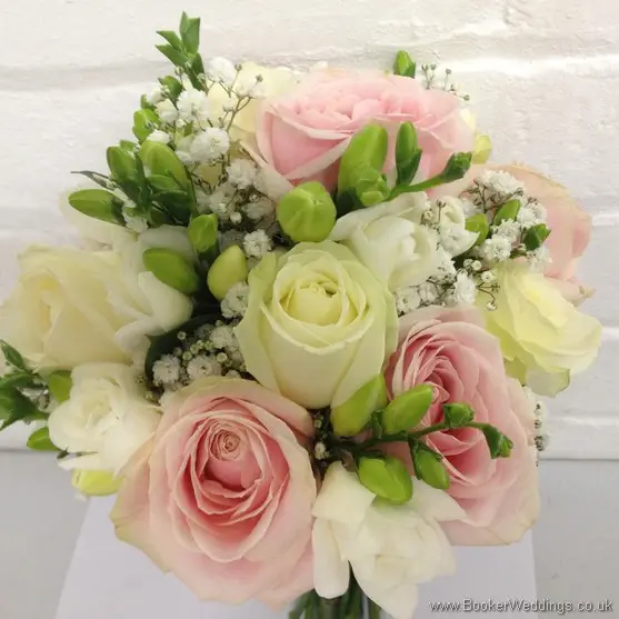 White, Cream and Pink Wedding Flowers with Roses, Freesias and Gypsophila in a hand tied bridal bouquet