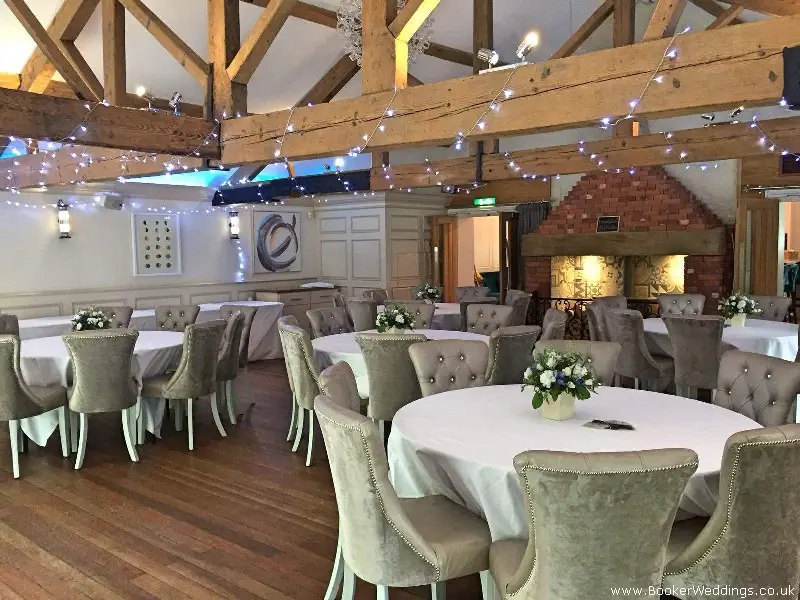Wedding Table Arrangements of Delphinium Stocks Spray Roses and Lissianthus at Allerton Manor Golf Club