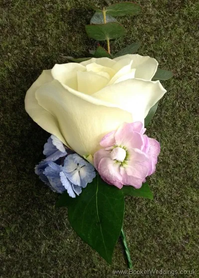 Pink & Blue themed Grooms Buttonhole with Ivory rose, Blue Hydrangea and Pink Stocks