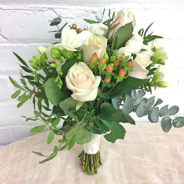 Bride Bouquet of Peach Roses Peach Hypericum White Freesia White Spray Roses and Eucalyptus