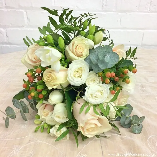 Bride Bouquet of Roses Hypericum Freesia Spray Roses and Eucalyptus