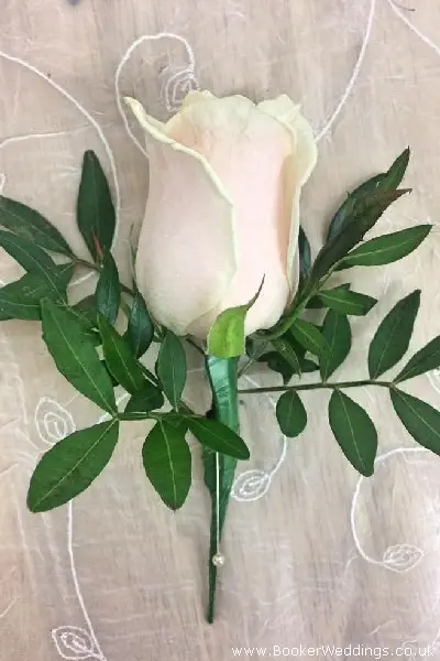 Wedding Buttonhole of Peach Rose and Pistachie
