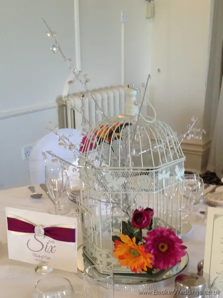 Vibrant Gerbera and Bird Cage Table Centrepiece at Leasowe Castle