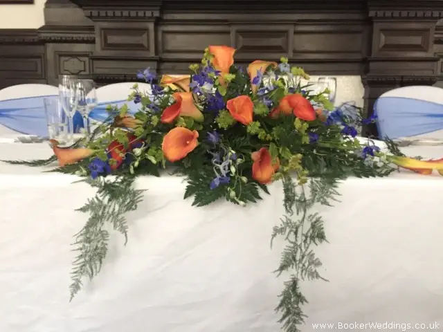 Top Table Arrangement Of Calla Lily Burperlum And Delphinium