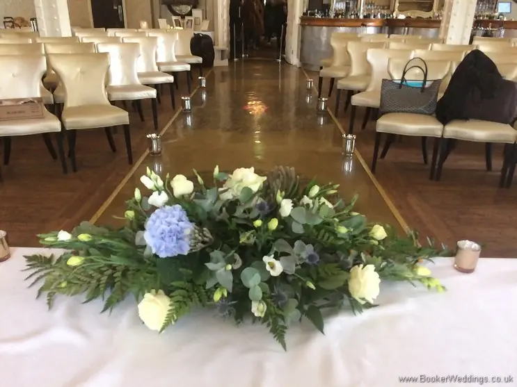 Long and Low Registrar Table Arrangement of Blue Hydrangea, Creams and Blush Pink roses,  Back View