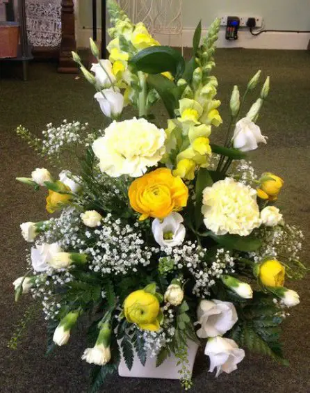 Yellow and White ranunculus Registrars Table Arrangement
