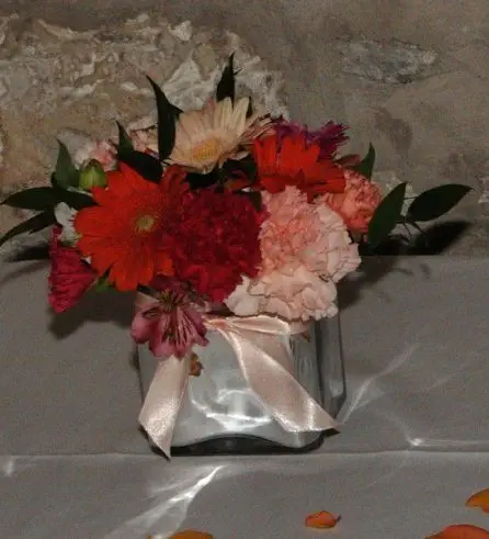 Table arrangements of Germini and Carnations 