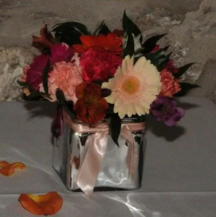Table arrangements of Germini and Carnations 