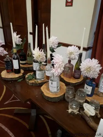 Table Centrepieces of Gin Bottles and Dahlias