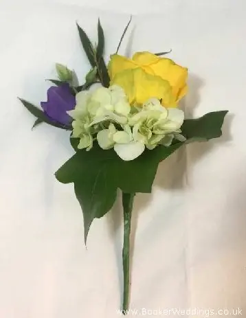 Classic yellow and purple rose buttonhole for groom
