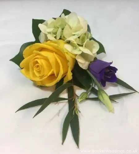 Fancy groom buttonhole using yellow, rose, hydrangea and lissianthus