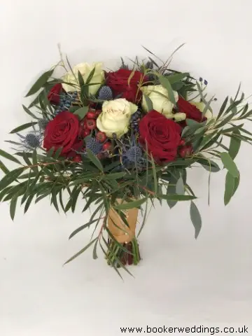 Wild Bride Handtied of Roses Eryngium and Rose Hips