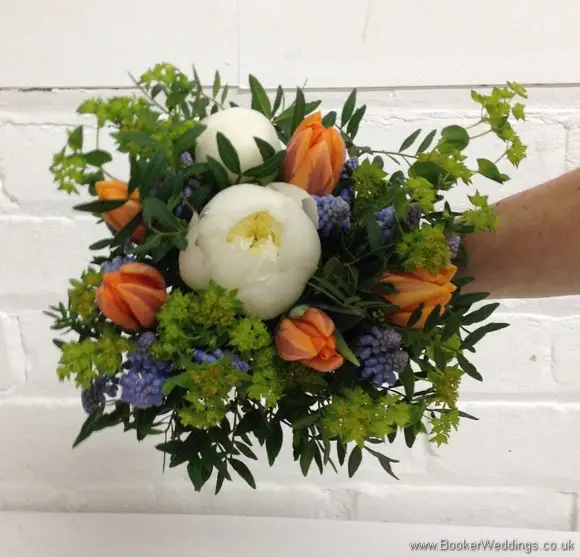 Bridesmaid Bouquet in a Spring Wedding Flower theme in creams, blues and oranges with muscari, tulips, peonies and bupleurum