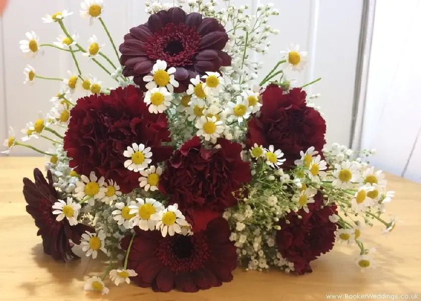 bride handtied bouquet gerbera carnations tanacetum daisys and gypsophila burgandy and white