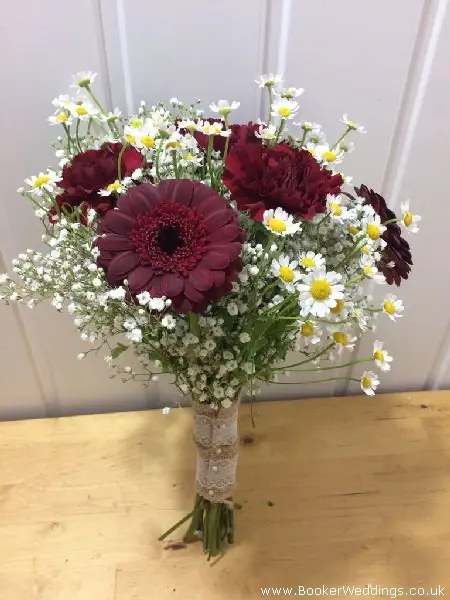 bridesmaid handtied bouquet burgandy gerbera carnations tanacetum daisys and gypsy grass with hessian handle